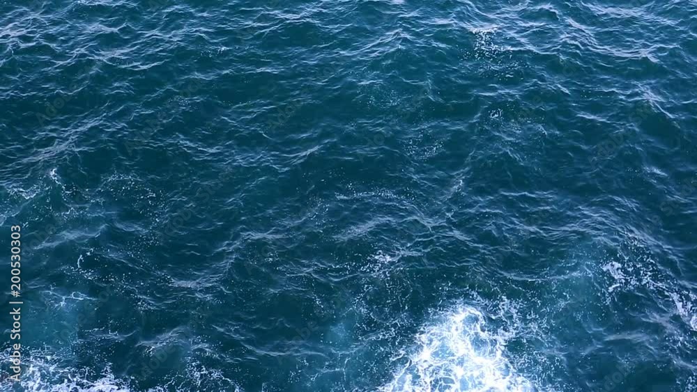Waves on the Sea. Top view of the Sea surface. Beautiful deep blue Ocean Water abstract background. Waves on the Sea. Top view of the Sea surface. Beautiful deep blue Ocean Water abstract background.