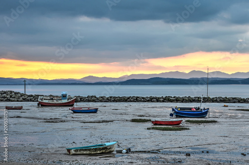 Canvastavla A variety of colorful little fishing boats and sloops stranded on the beach of M