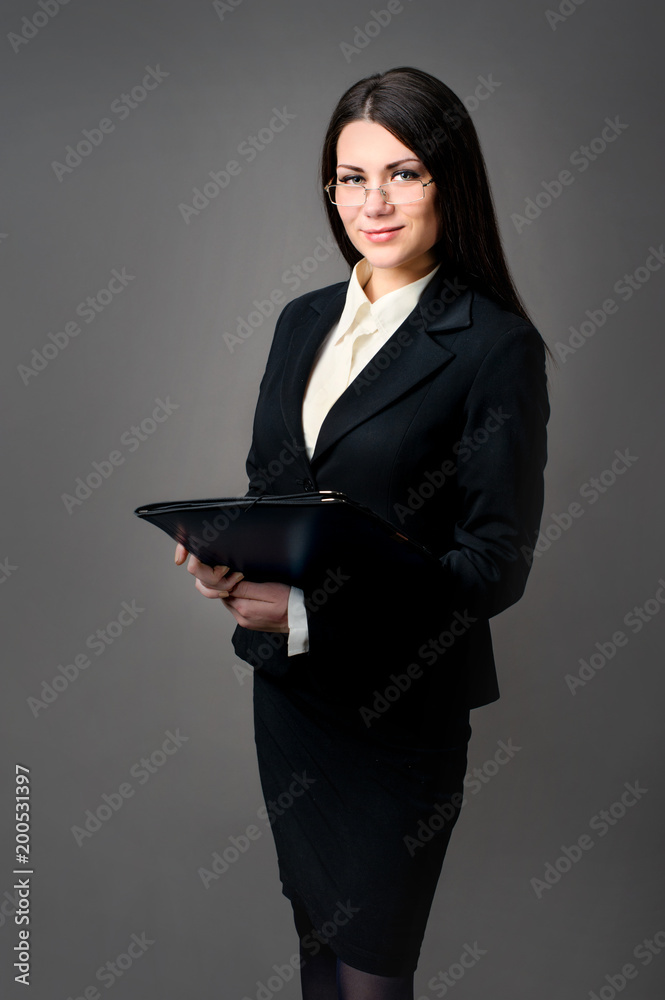 secretary in glasses with a document folder secretary in glasses with a document folder