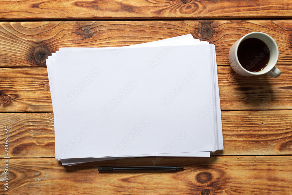 White business card on wooden table. Blank portrait A4. White business card on wooden table. Blank portrait A4.