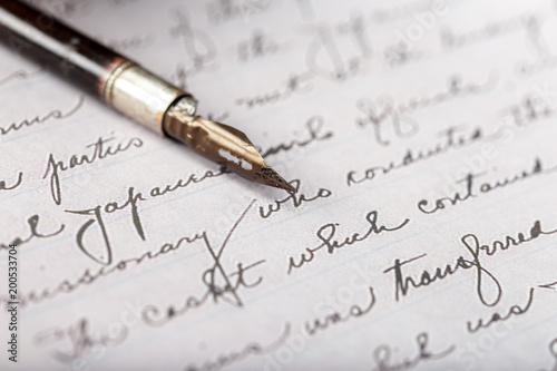 Fountain pen on an antique handwritten letter