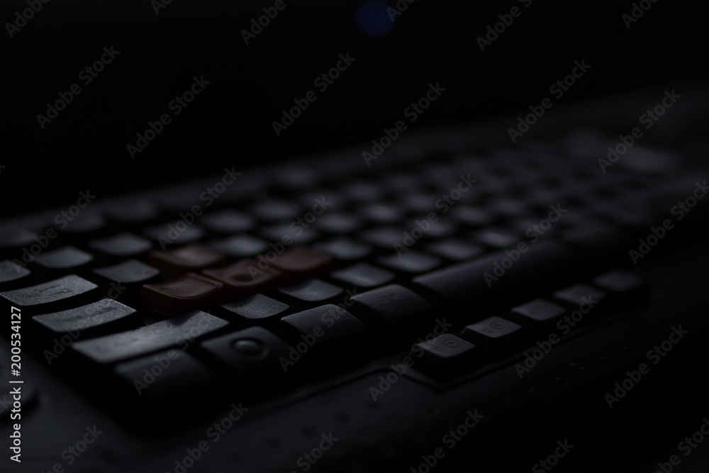 The screen of the programmer working late at night behind a computer The screen of the programmer working late at night behind a computer
