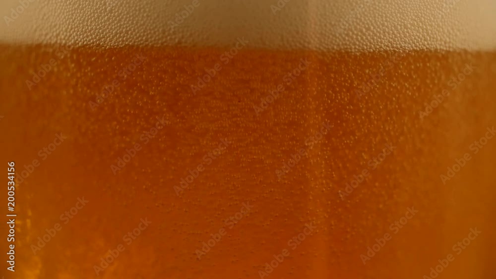 Detail of beer bubbles, slowmotion shot Detail of beer bubbles, slowmotion shot