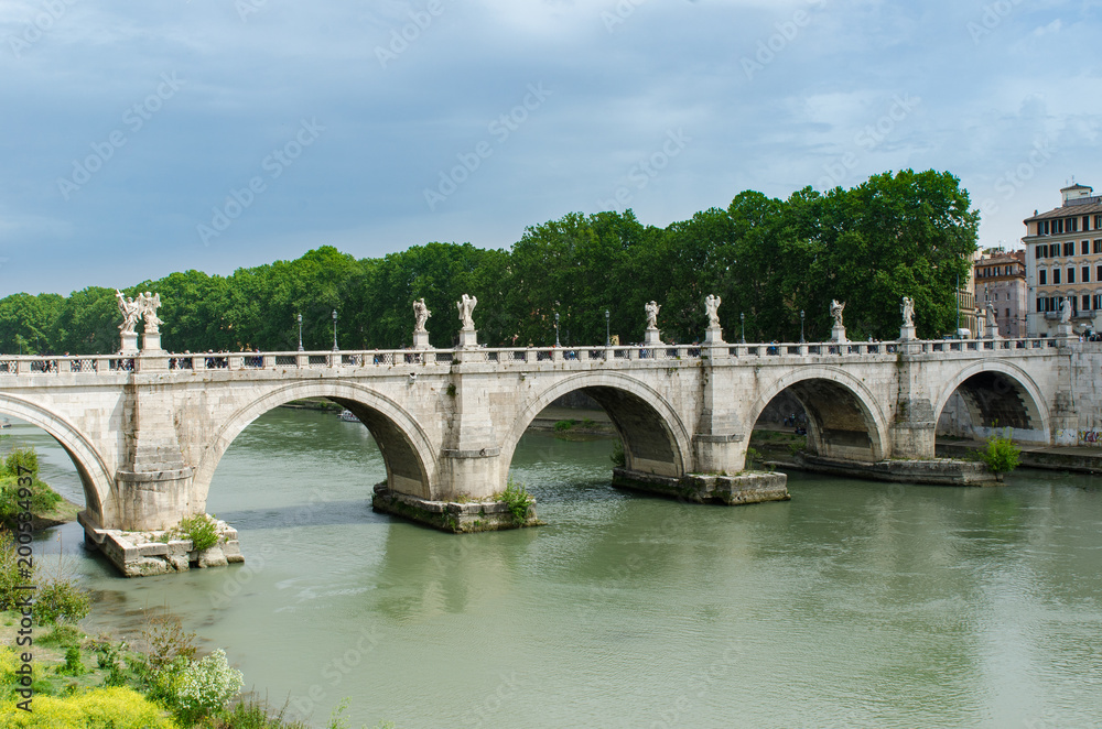 St. Angelo Bridge, built by the Roman Emporer Hadrian, is a pedestrian bridge. Spanning the River Tiber., it was built in 134 A.D., with travertine marble fascias