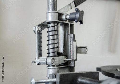Mechanism with a spring, press