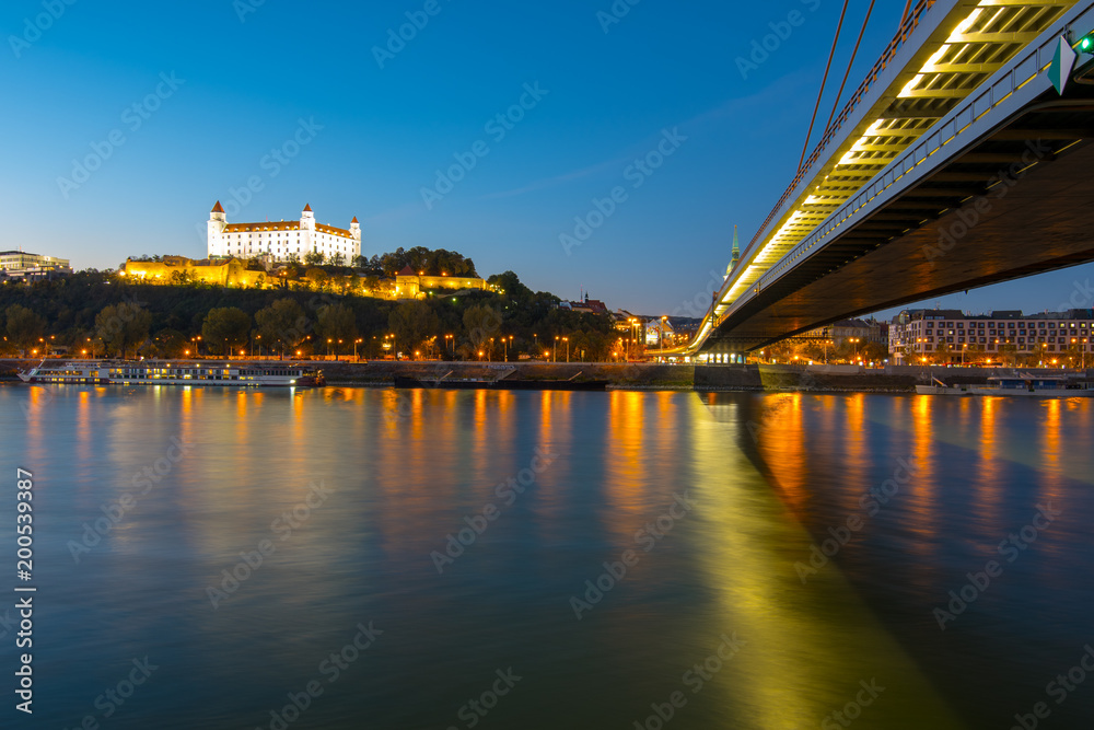 The famous Slovakian Castle stands proud on his hill in Bratislava as the night draws in