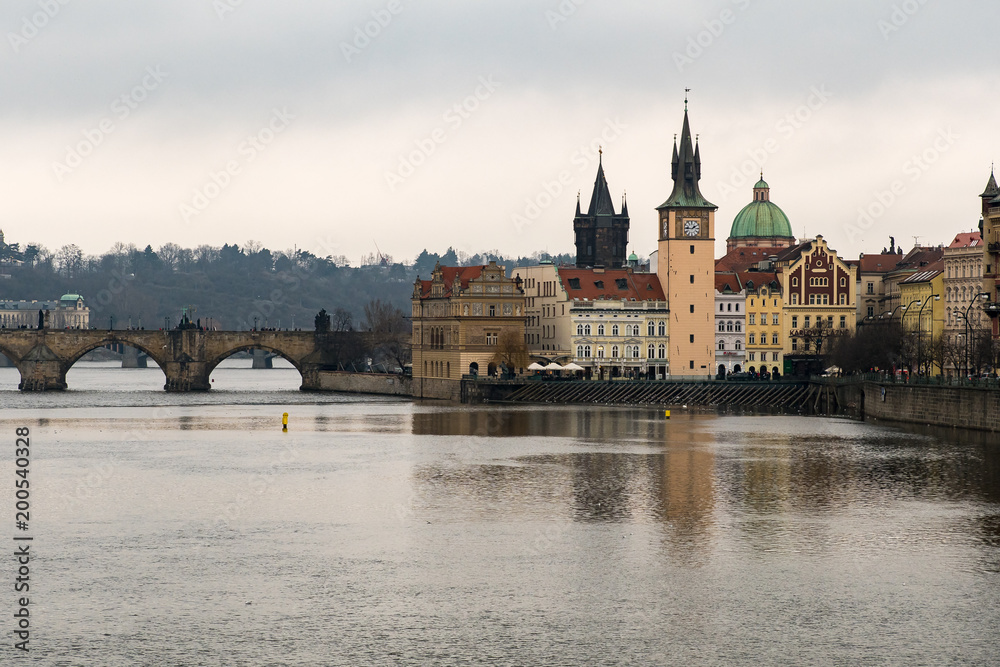 A view of the Charles Bridge, and surrounding cityscape in Prague's Old Town
