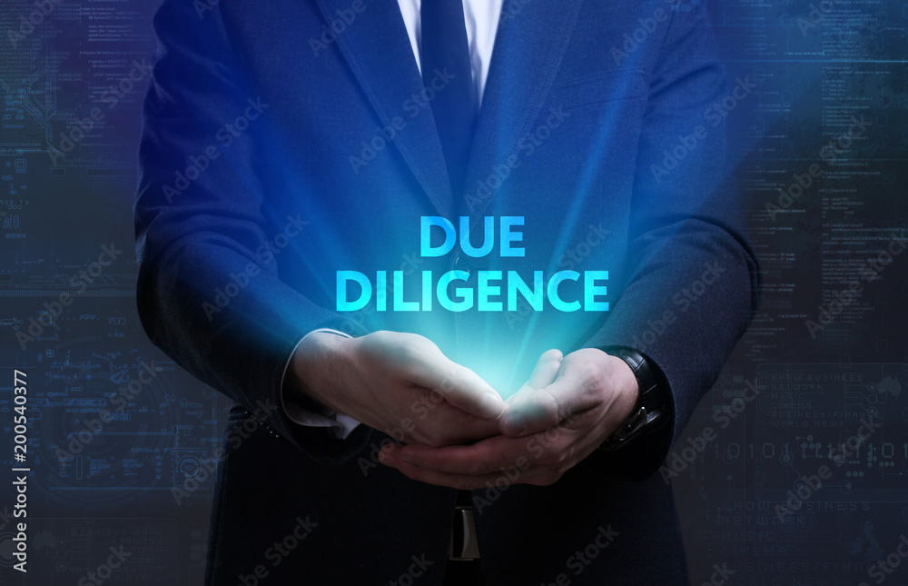 Business, Technology, Internet and network concept. Young businessman working on a virtual screen of the future and sees the inscription: Due diligence Business, Technology, Internet and network concept. Young businessman working on a virtual screen of the future and sees the inscription: Due diligence