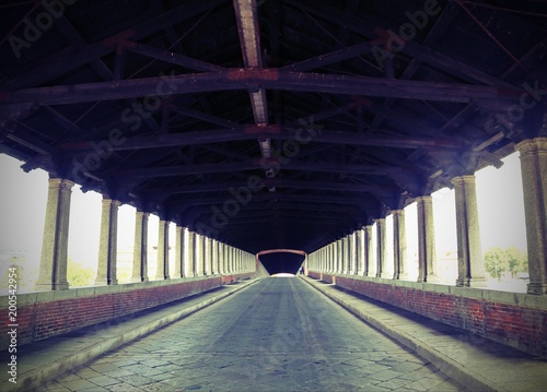 wooden bridge in Pavia in Italy with vintage effect