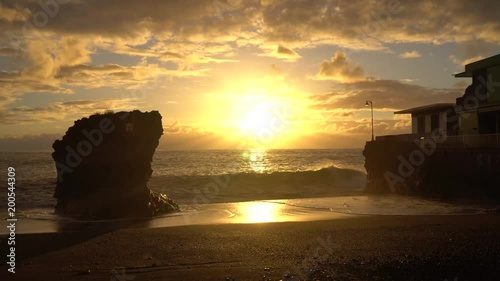 Beautiful sunset at the Atlantic Ocean in Puerto Naos at La Palma / Canary Islands photo