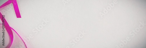 Pink ribbon on white background