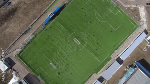 Aerial view of district soccer field with players training on grass