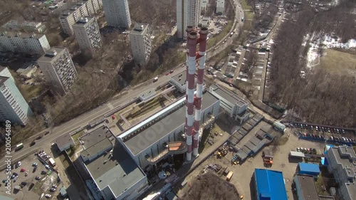 Smoking pipes in industrial zone of the city near residential area