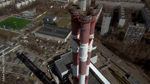Smoking pipes in industrial zone of the city near residential area