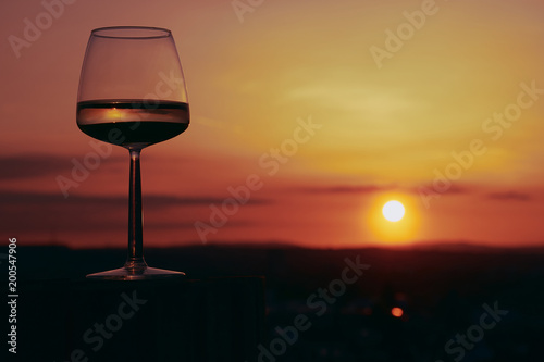 Wine glass in the sunset in the vineyards in Mainz 