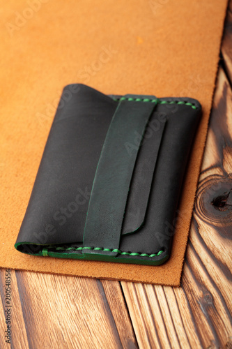 Dark greenleather wallet.Genuine leather craft object using for wallet.Hand crafted wallet
