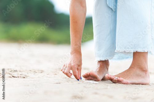 Tidy tanned soft woman feet. Summertime outdoors close-up. © AnnaElizabeth