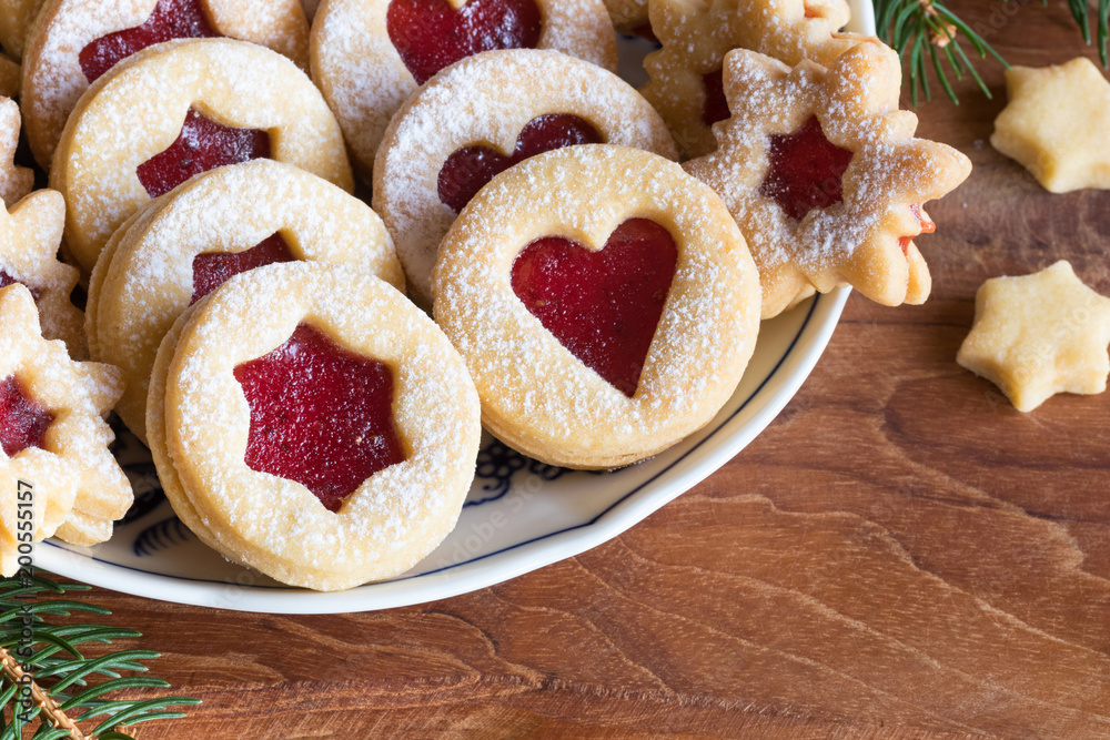 Linzer Christmas cookies arranged on a plate