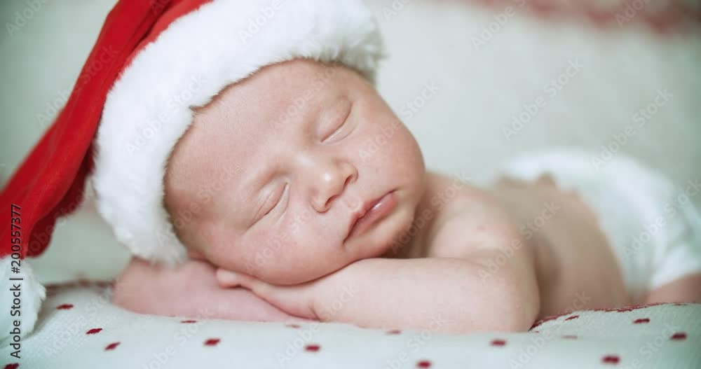 Close up, little baby sleep with Santa Claus hat