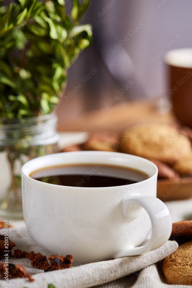 Breakfast background with mug of fresh coffee, homemade oatmeal cookies, grind coffee Breakfast background with mug of fresh coffee, homemade oatmeal cookies, grind coffee