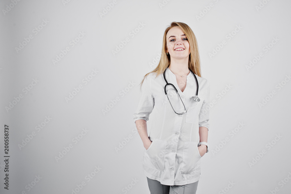 Blonde doctor nurse with stethoscope isolated on white background. Blonde doctor nurse with stethoscope isolated on white background.