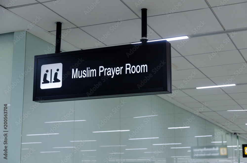 hanging prayer room sign for muslim on ceiling in office building, subway train station, airport or shopping mall, religion concept