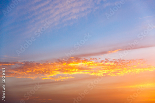 Golden sunset clouds at blue sky
