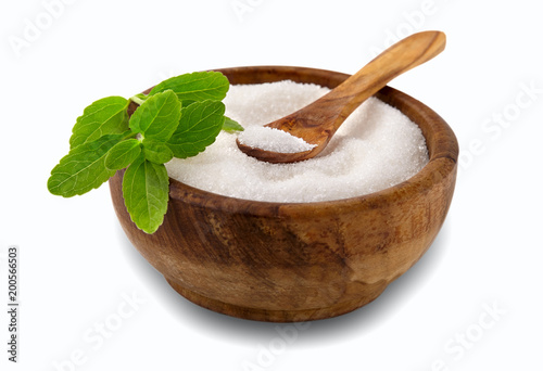 Valokuva Stevia rebaudiana, sweet leaf sugar substitute isolated in wooden bowl on white
