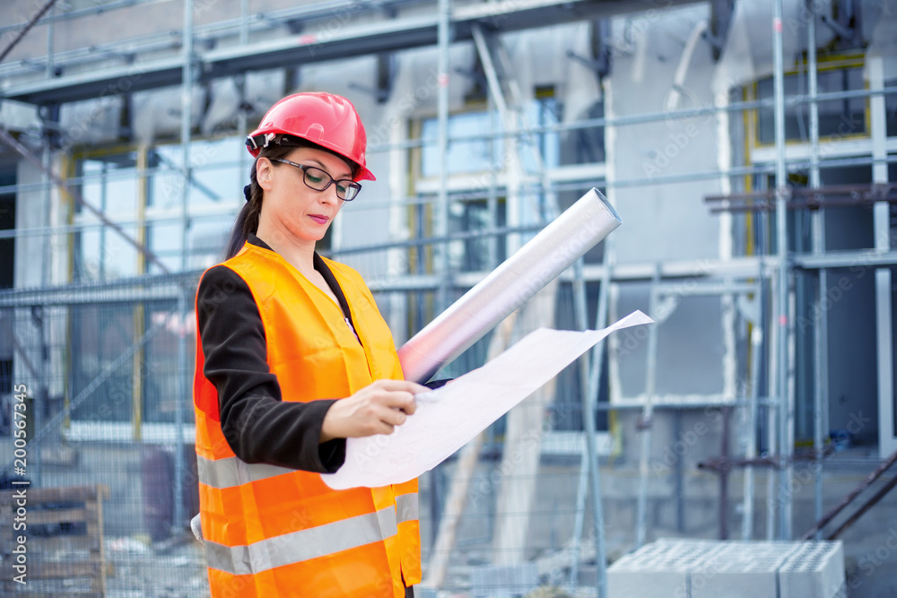 Woman Engineer with planns