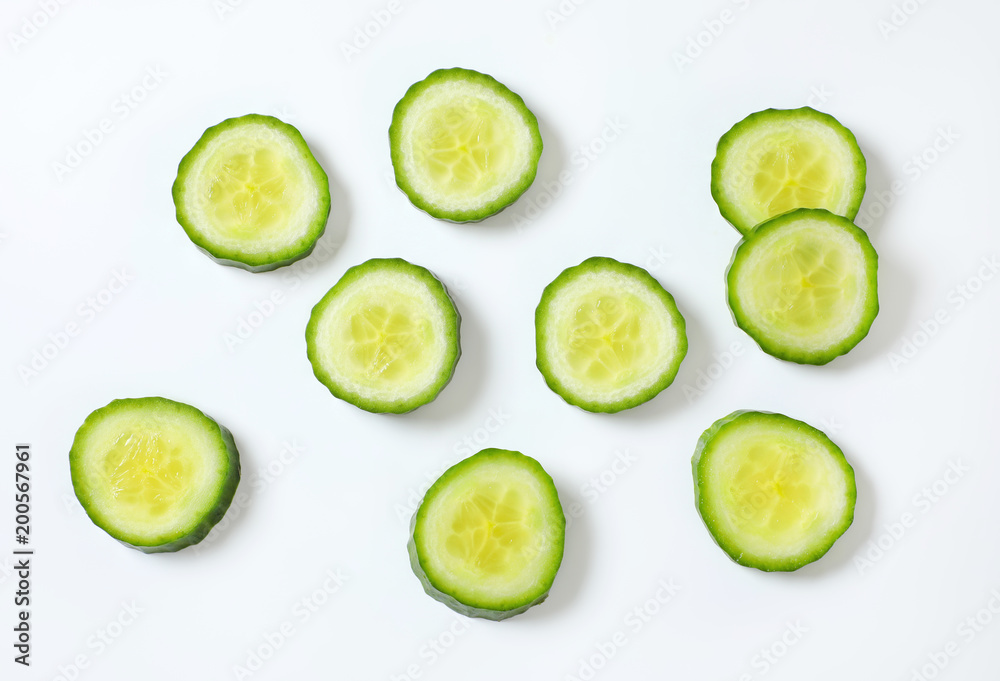 slices of green cucumber slices of green cucumber