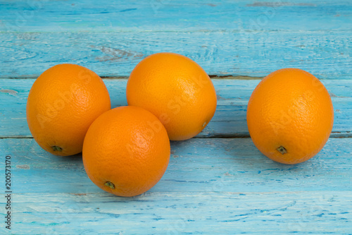 Ripe orange fresh orange, on wooden background. photo