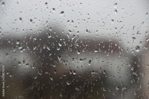 Background, texture – drops of rain water on the misted glass window cloudy autumn