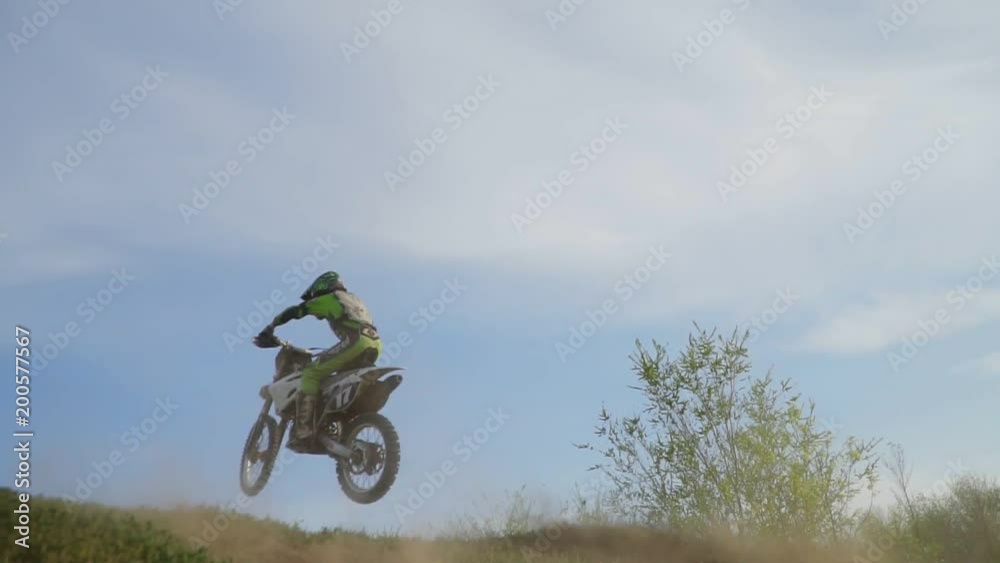 Enduro motocross off-road racing. dust from under the wheels Enduro motocross off-road racing. dust from under the wheels