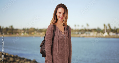 Bilde på lerret Caucasian girl in her 20s looking at camera standing outside