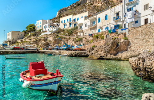 View of Levanzo Island with Fisherman boat in foreground, is the smallest of the three Aegadian islands in the Mediterranean sea of Sicily, Trapani, Italy photo