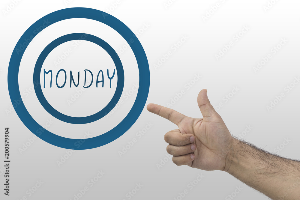 male's hand pointing a circle with inscription: Monday male's hand pointing a circle with inscription: Monday