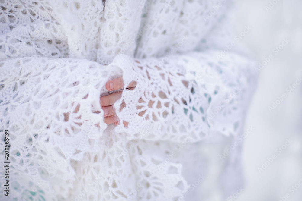 White knitted shawl in winter White knitted shawl in winter