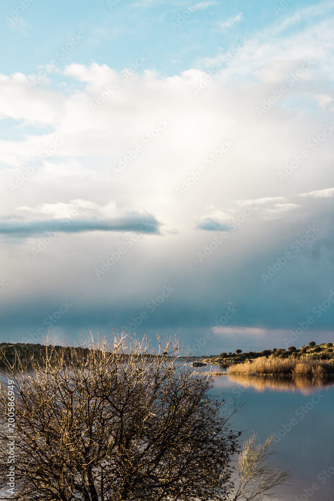 Obraz premium landscape with clouds and reflections in the river