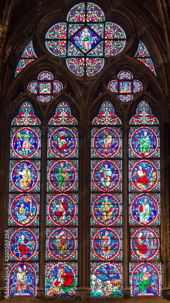 Wonderful stained glass window with sacred images.