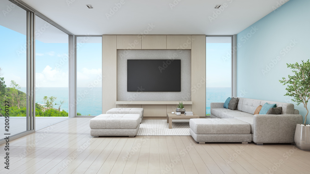 Fototapeta premium Sea view living room of luxury beach house with glass door and wooden terrace. Large white sofa against blue wall near TV in vacation home or holiday villa for big family. Hotel interior 3d rendering.
