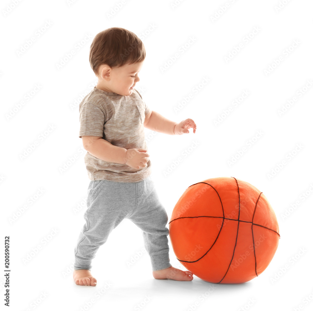 Cute baby playing with ball on white background. Learning to walk Cute baby playing with ball on white background. Learning to walk