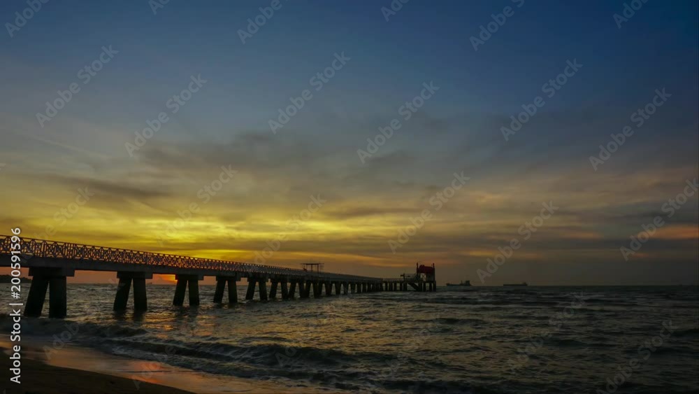 Timelapse of sunset over the long jetty at seaside. Timelapse of sunset over the long jetty at seaside.