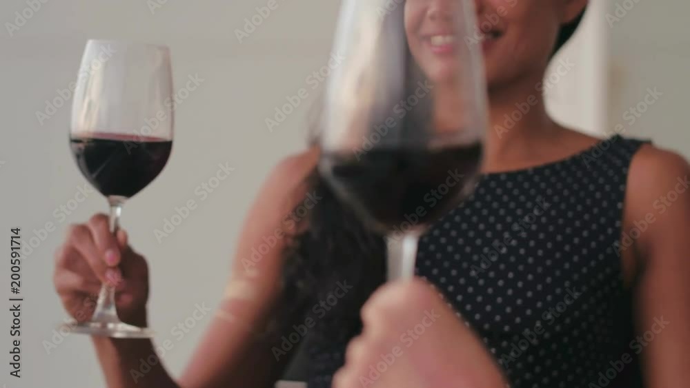 Asian woman holding wineglass and drinking red wine together friend outdoor Asian woman holding wineglass and drinking red wine together friend outdoor