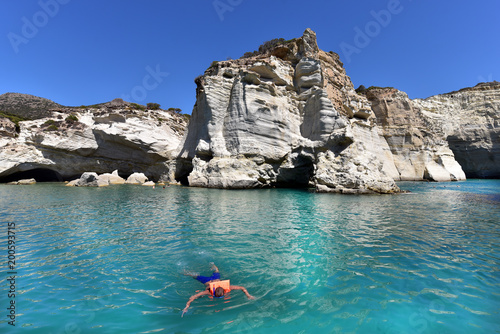 Snorkelers are swimming at Kleftiko, Kleftiko, Milos, Greece © akturer