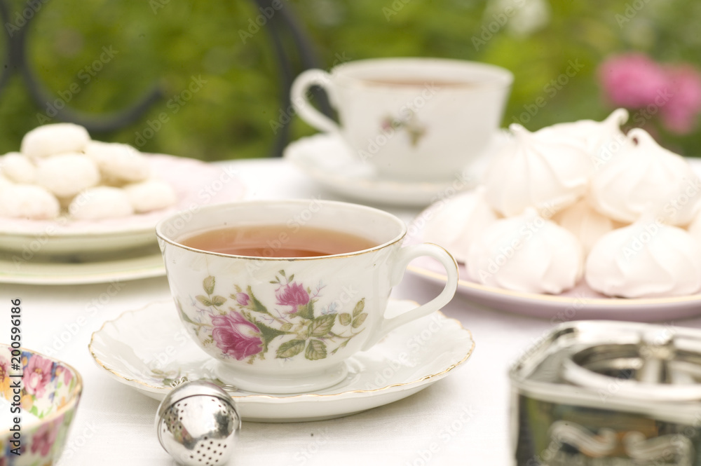 Coffee cup with breakfast on white table outdoors Coffee cup with breakfast on white table outdoors