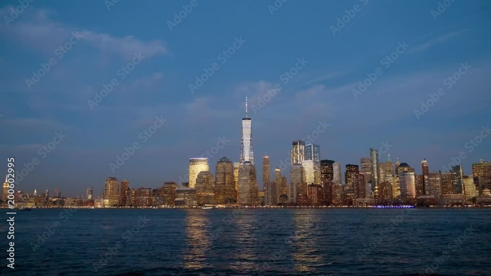 Overlooking the New York Skyline at dusk over the Hudson River as the buildings reflect in the water. Overlooking the New York Skyline at dusk over the Hudson River as the buildings reflect in the water.