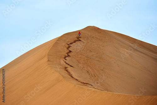 sand-dune and the lonely traveler. In physical geography, a dune is a hill of loose sand.