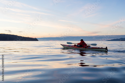 Ocean Kayaking during Sunset. Taken in Vancouver  British Columbia  Canada. Concept  sport  adventure  fitness  vacation  holiday.