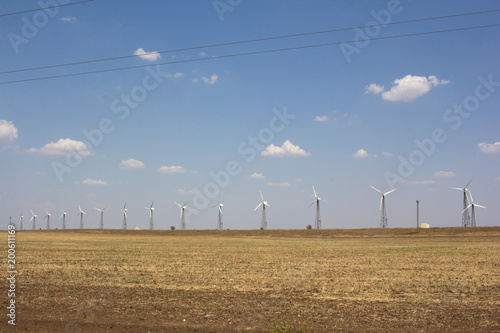 A stunning view of the deserted steppe, set by windmills. photo