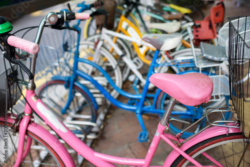 Pink bicycle. Bicycle rental in the city. © Anastasiia